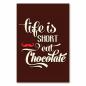 Preview: Brauner Hintergrund mit Schriftzug "Life is Short Eat Chocolate" und rotem Schnurrbart.